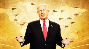 Donald Trump in front of a map with tiny Trump flags.