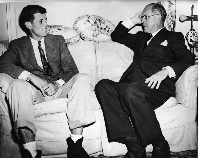 American financier and ambassador Joseph Kennedy (1888 - 1969) (right) sits on a couch with his son, future American President John F. Kennedy (1917 - 1963), 1938.