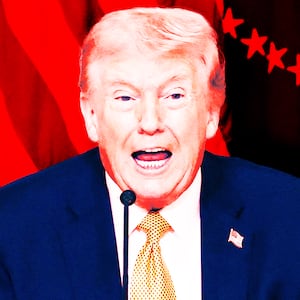 President Donald Trump, flanked by the Speaker of the House Mike Johnson (R-LA) and White House chief of staff Susie Wiles, speaks during a lunch with the Kennedy Center board members in the East Room of the White House in Washington, D.C., on March 16, 2026.
