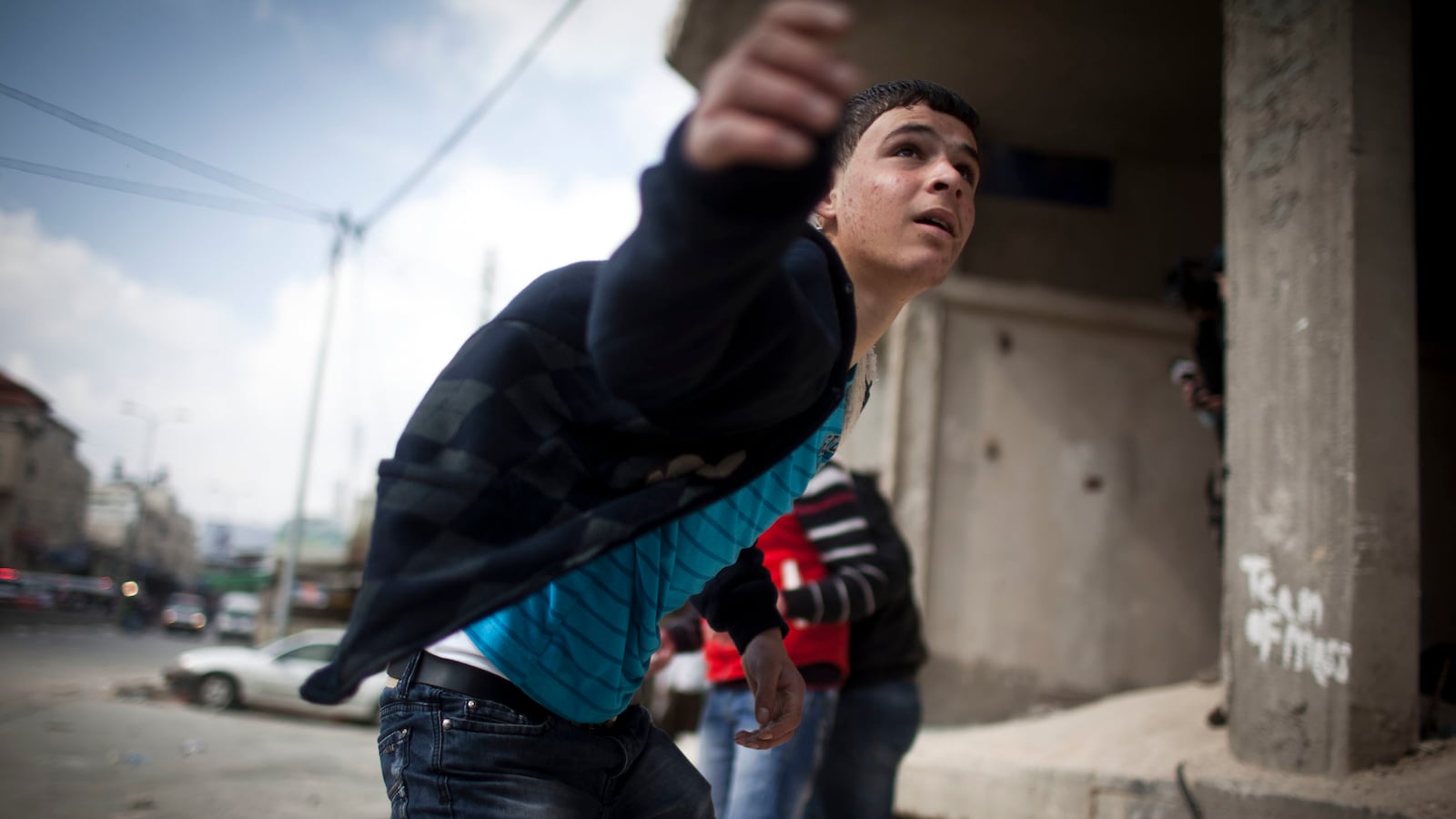 articles/2013/01/31/dostoyevsky-in-the-west-bank/palestinianboythrowingstone_kw7p6a