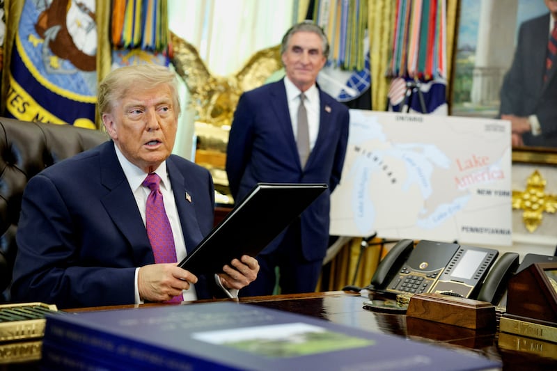 U.S. President Donald Trump holds an executive order renaming Lake Ontario as Lake America after signing it at the Oval Office of the White House in Washington, D.C., U.S., August 27, 2026. REUTERS/Evan Vucci