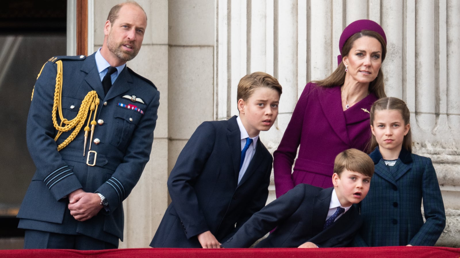 Prince William, Prince of Wales, Prince George, Catherine, Princess of Wales, Prince Louis and Princess Charlotte watch a flypast to mark the 80th anniversary of VE Day on May 5, 2025 in London, England.