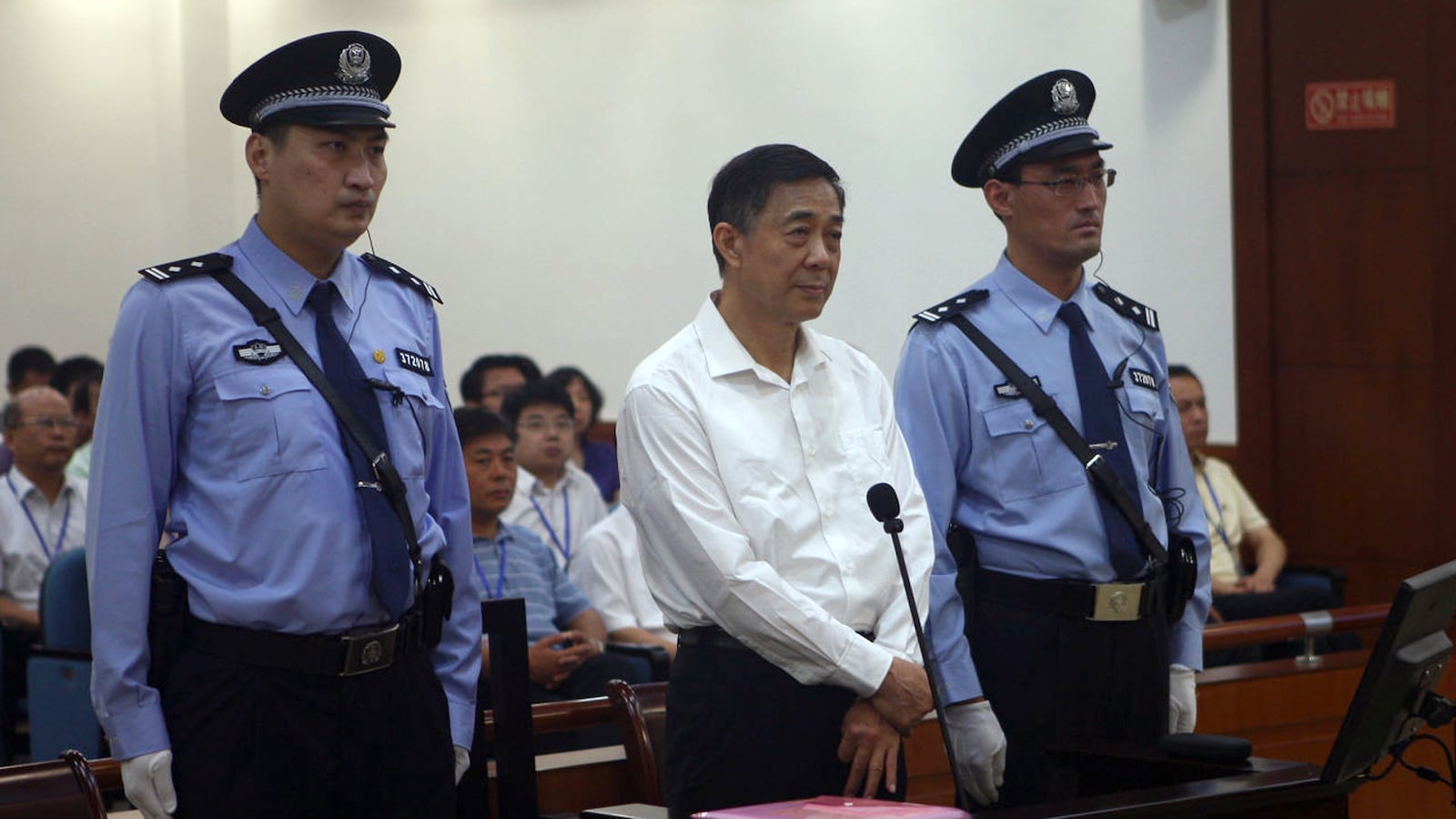 articles/2013/08/23/bo-xilai-s-perfect-show-trial/130823-huang-boxilai-tease_agefy5