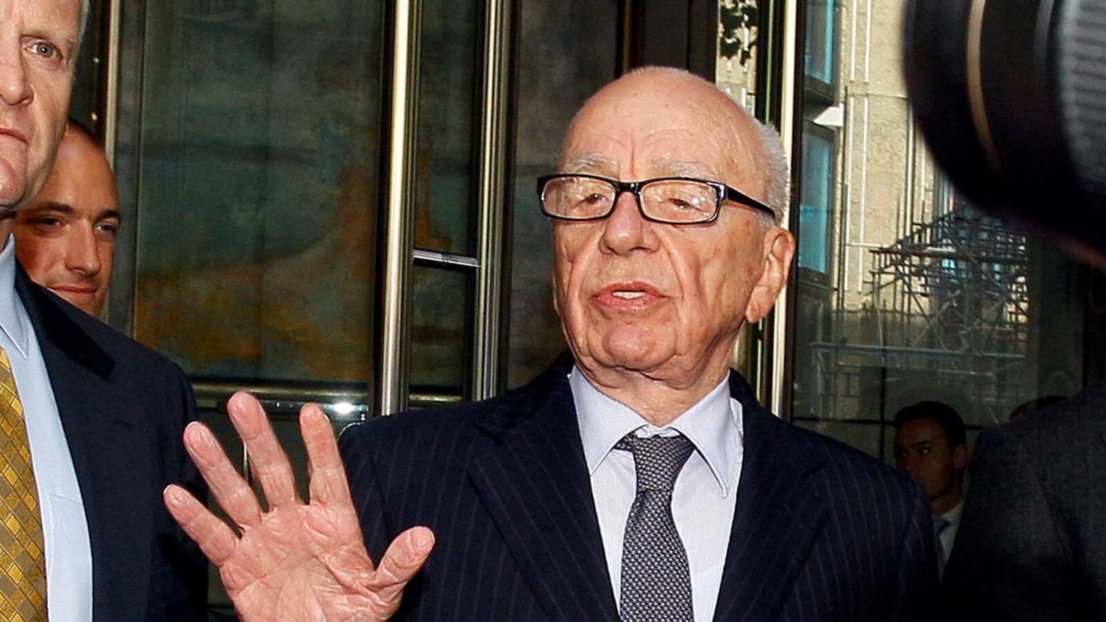 articles/2012/02/13/murdoch-foe-mark-lewis-may-file-suit-in-the-u-s/murdoch-hand-cheat_iaw8gk