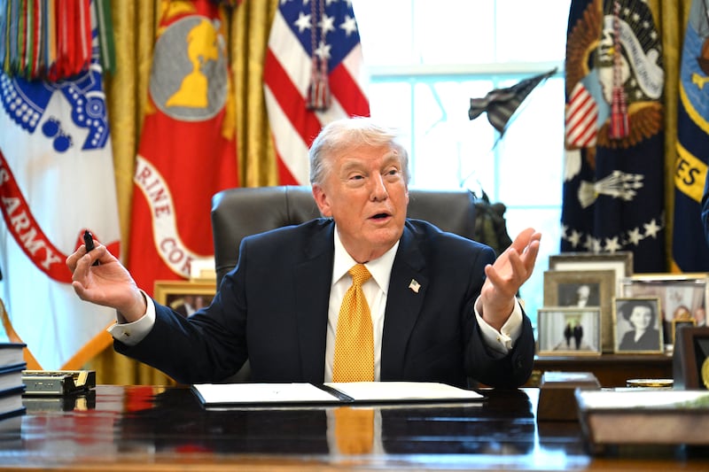 US President Donald Trump speaks while signing an executive order on fraud in the Oval Office at the White House