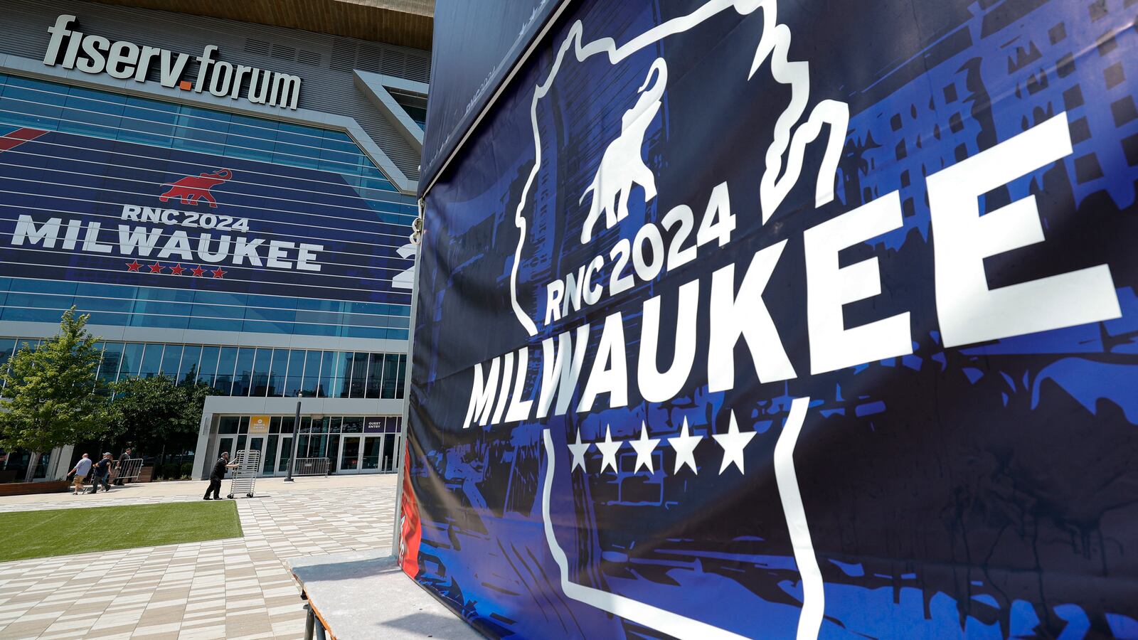 People walk outside the Fiserv Forum ahead of the 2024 Republican National Convention