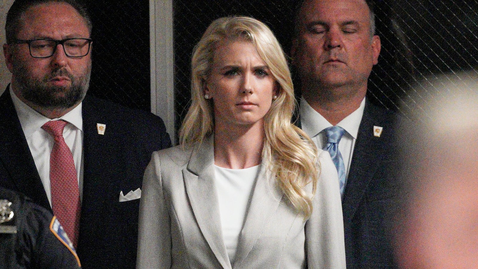 Natalie Harp listens as former U.S. President Donald Trump speaks outside of Manhattan Criminal Court on April 30, 2024 in New York City.
