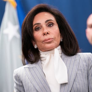 U.S. Attorney for the District of Columbia Jeanine Pirro looks on while announcing charges in connection with an international car theft ring during a press conference at the Justice Department in Washington, D.C., U.S., April 22, 2026. REUTERS/Nathan Howard