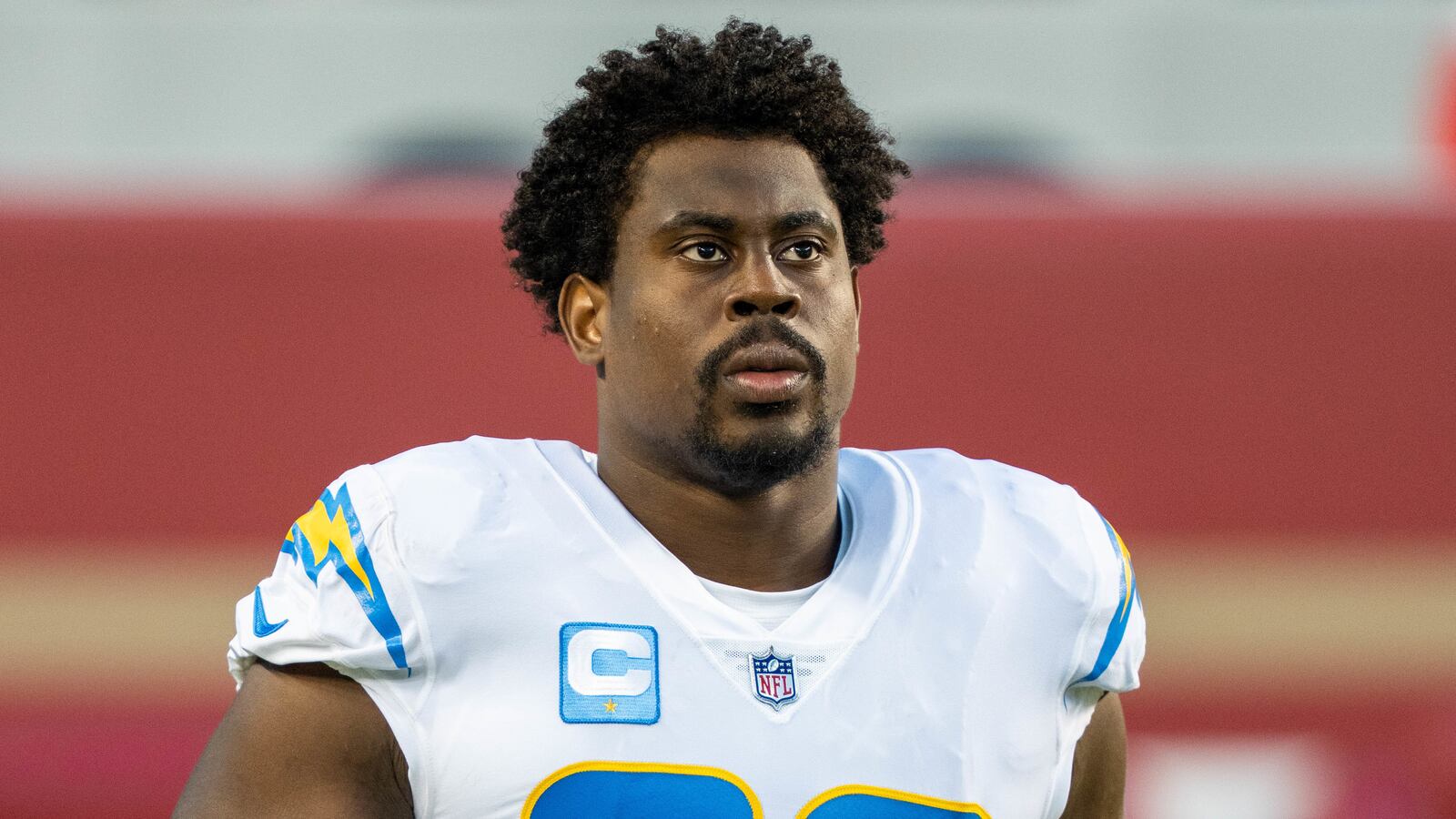 Sebastian Joseph-Day wears an L.A. Chargers jersey on the field