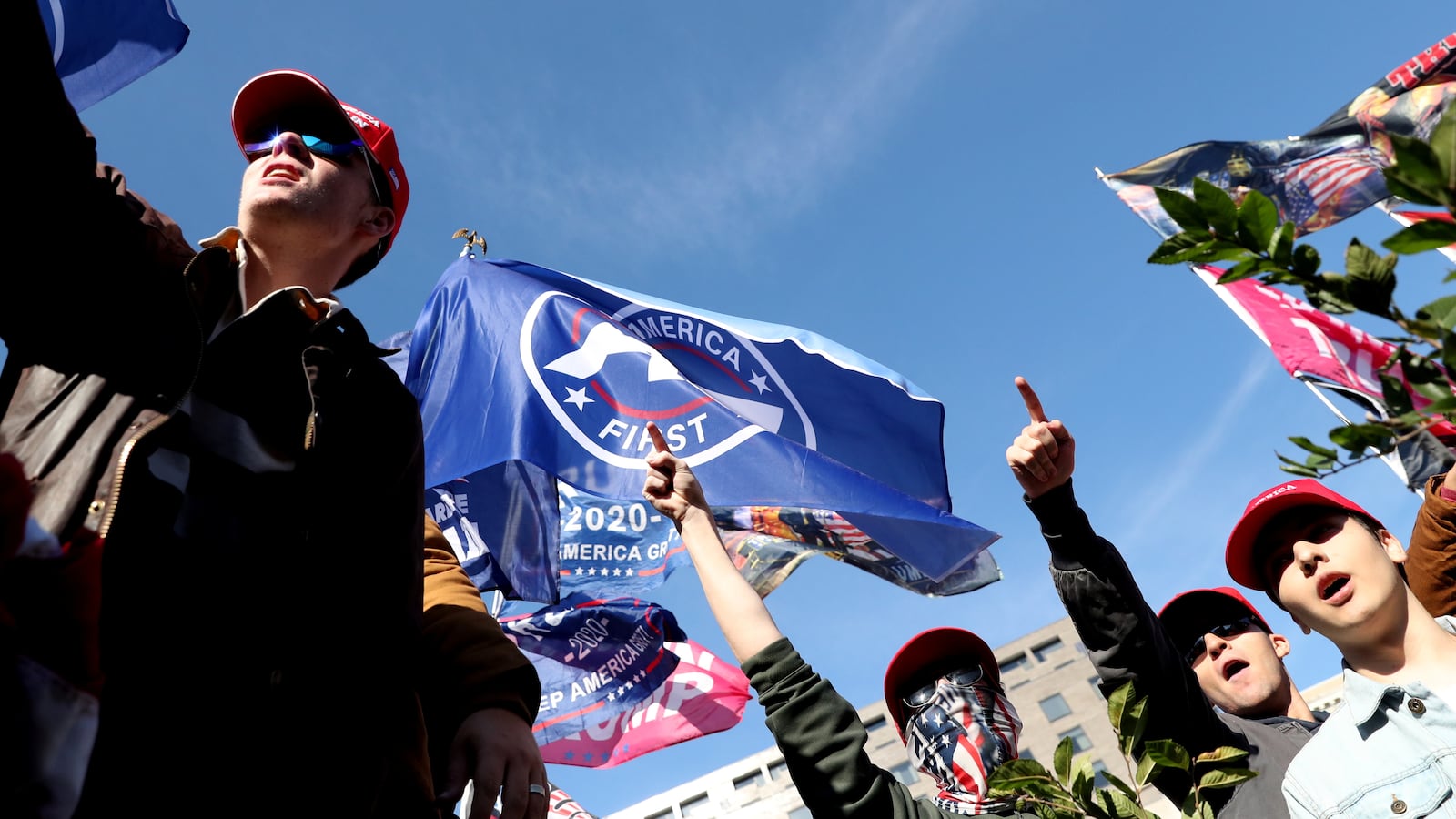 Supporters of the America First ideology and Donald Trump listen to Nick Fuentes as they participate in Stop the Steal and Million MAGA March protests, in Washington, D.C. Nov. 14, 2020.