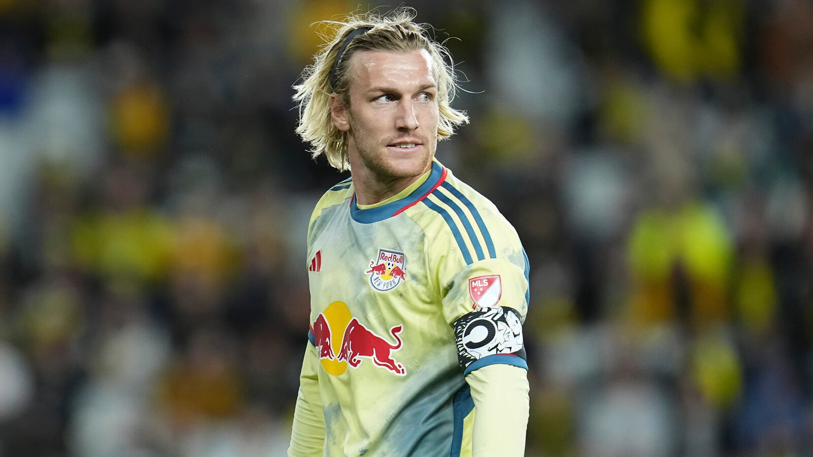 Emil Folsberg, wearing his New York Red Bulls uniform, walks during a game.