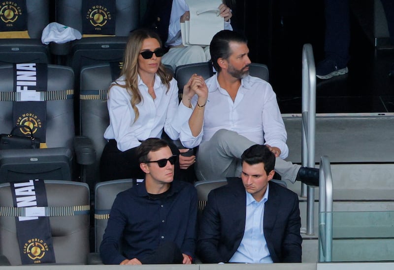 Soccer Football - FIFA Club World Cup - Final - Chelsea v Paris St Germain - MetLife Stadium, East Rutherford, New Jersey, U.S. - July 13, 2025 U.S. President Donald Trump's son Donald Trump Jr. and his partner Bettina Anderson in the stand during the match REUTERS/Brian Snydey