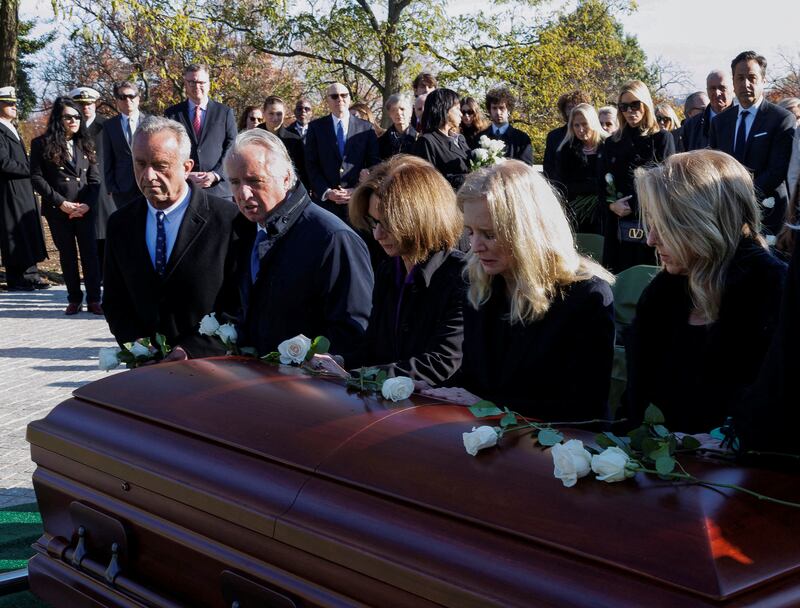 Robert F. Kennedy Jr., Chris Kennedy, Kathleen Kennedy Townsend, Kerry Kennedy, and Rory Kennedy kneel at the casket of their mother Ethel Kennedy in 2024.