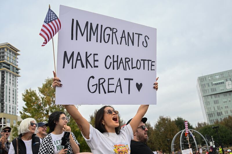 Protesters gather at First Ward Park for the 'No Border Patrol In Charlotte' rally to raise their voices for the immigrant community and against ICE raids and Border Patrol activity in Charlotte, North Carolina, US on November 15, 2025.