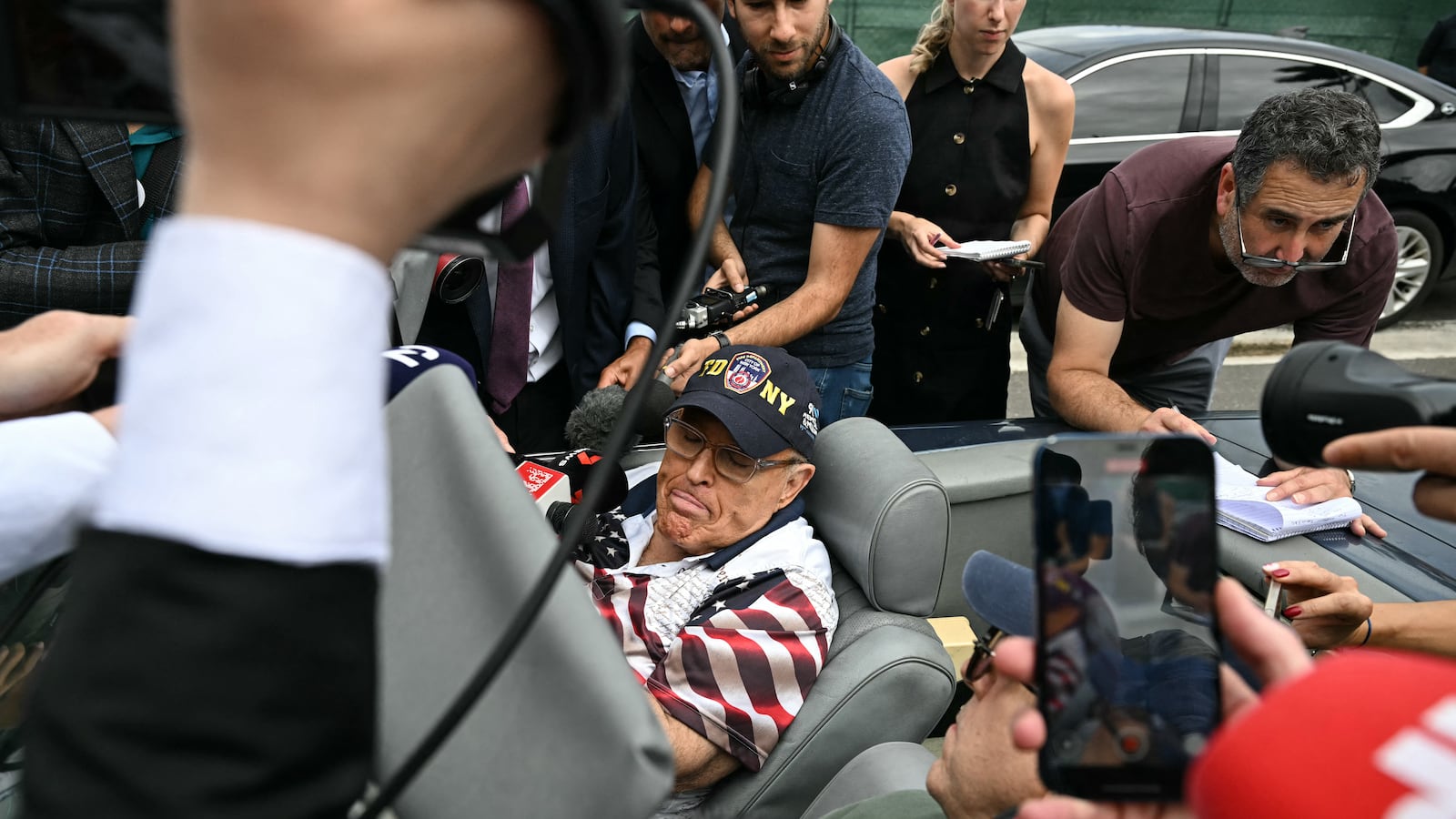 Former New York City Mayor Rudy Giuliani speaks to the media before former US President and Republican presidential candidate Donald Trump arrives to vote at a polling station at Mandel Recreation Centre in Palm Beach, Florida, on November 5, 2024.