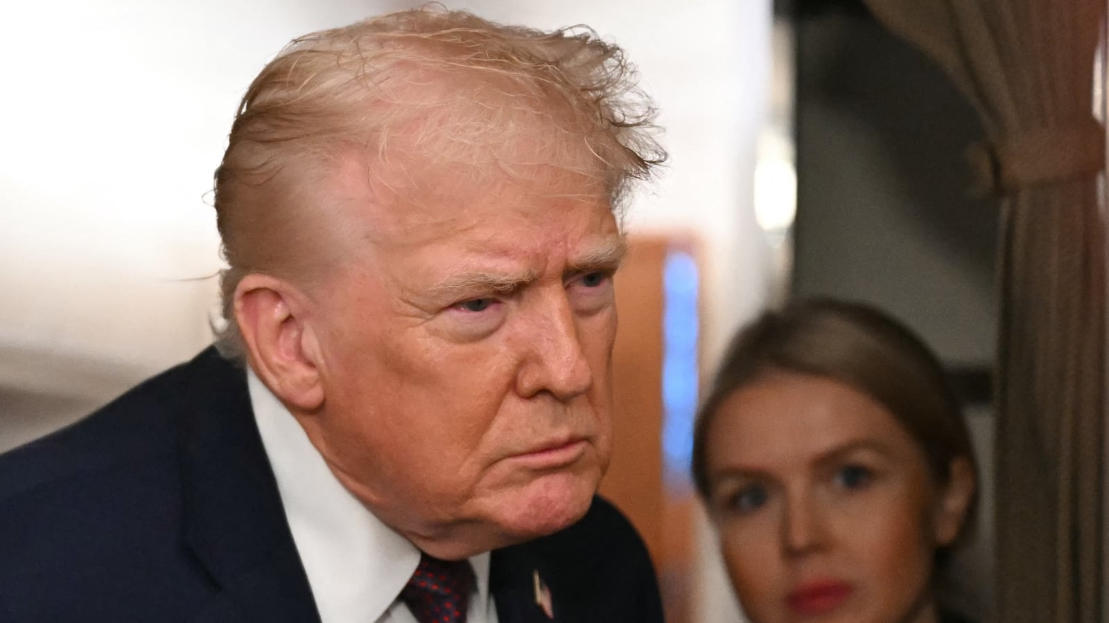 US President Donald Trump speaks to the press aboard Air Force One on January 11, 2026. Trump said Sunday his administration was working well with Venezuela's interim leader Delcy Rodriguez and that he would be open to meeting with her. (Photo by ANDREW CABALLERO-REYNOLDS / AFP via Getty Images)