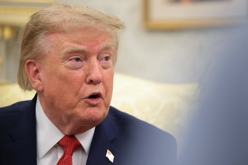 U.S. President Donald Trump speaks as he hosts 16-year-old lifeguard Ryder Williams, who saved a child off the coast of Santa Cruz, California, last month, Nathaniel Rai, the child saved by Williams, and Nathaniel's family members in the Oval Office at the White House in Washington, D.C., U.S., August 17, 2026.