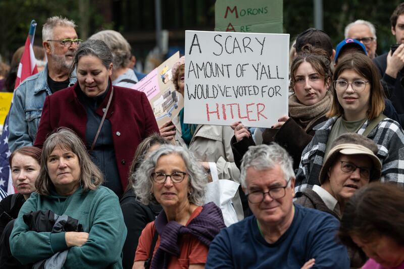 LONDON, ENGLAND - OCTOBER 18: A crowd of mainly American anti Trump protestors holds signs outside the US Embassy London during a "No Kings" protest against U.S. President Donald Trump at  on October 18, 2025 in London, England. The protests follow similar "No Kings" events in the United States. (Photo by Guy Smallman/Getty Images)