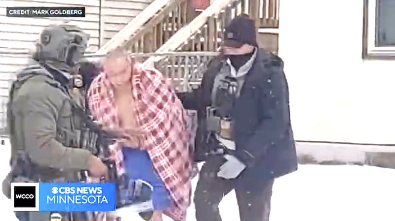 ChongLy “Scott” Thao is dragged of his house, wearing just underwear, by ICE agents into the snow.