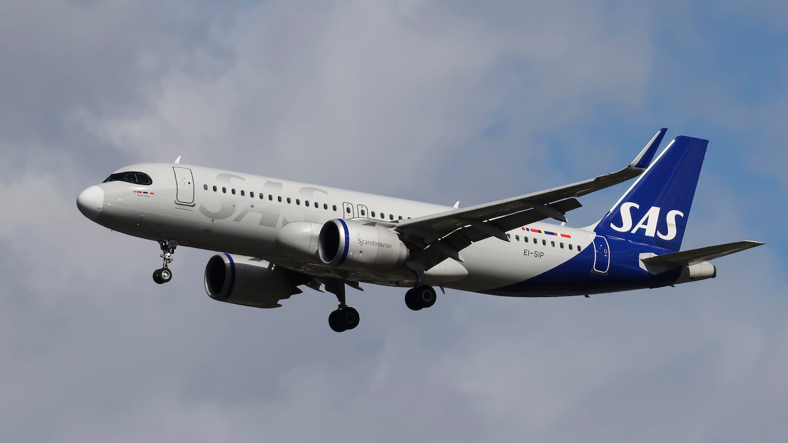 SAS Connect Airbus A320neo passenger aircraft spotted flying before landing on the runway of London Heathrow Airport LHR in the United Kingdom. The A320 NEO airplane has the registration tail number EI-SIP the name Agnar Vking and is powered by 2x CFMI LEAP-1A26 jet engines. SAS Connect is legally Scandinavian Airlines Ireland Ltd airline carrier subsidiary of Scandinavian Airlines SAS Group legally referred to as Scandinavian Airlines System Denmark Norway Sweden with a fleet of 133 planes. September 2024 (Photo by Nicolas Economou/NurPhoto via Getty Images)