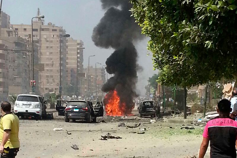 articles/2013/09/05/a-bloody-assassination-attempt-in-egypt/130905-car-bomb-egypt-tease_tsluua