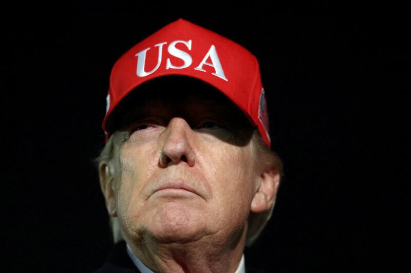 U.S. President Donald Trump looks on after disembarking Air Force One as he arrives at Joint Base Andrews in Maryland, U.S., April 12, 2026.  REUTERS/Kevin Lamarque     TPX IMAGES OF THE DAY