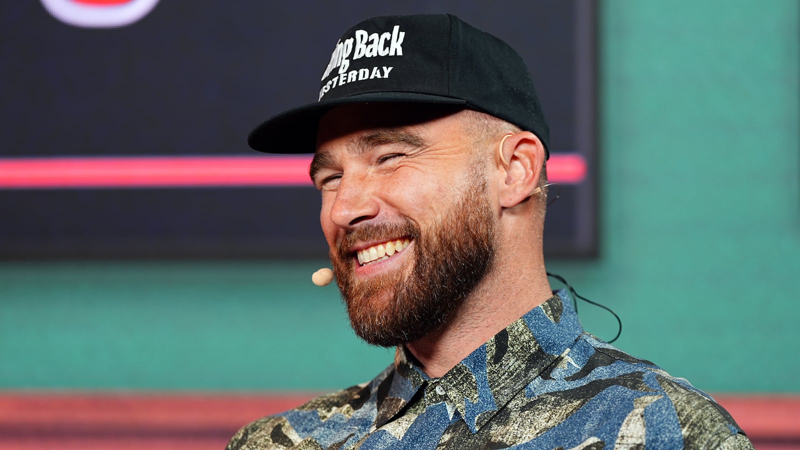 Travis Kelce smiling at the 2024 Big Slick Celebrity Weekend.