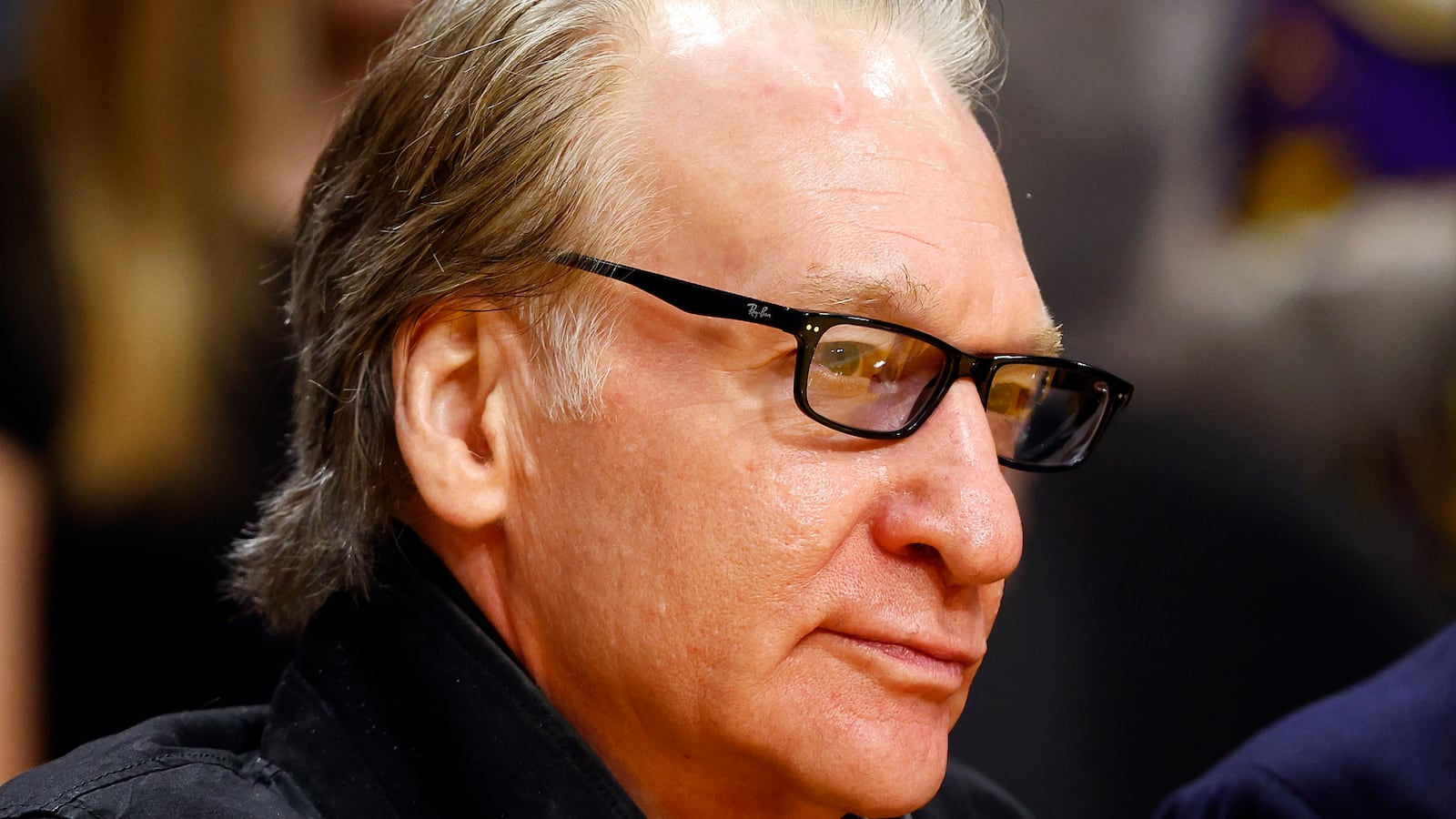 A photograph of Bill Maher, in profile.