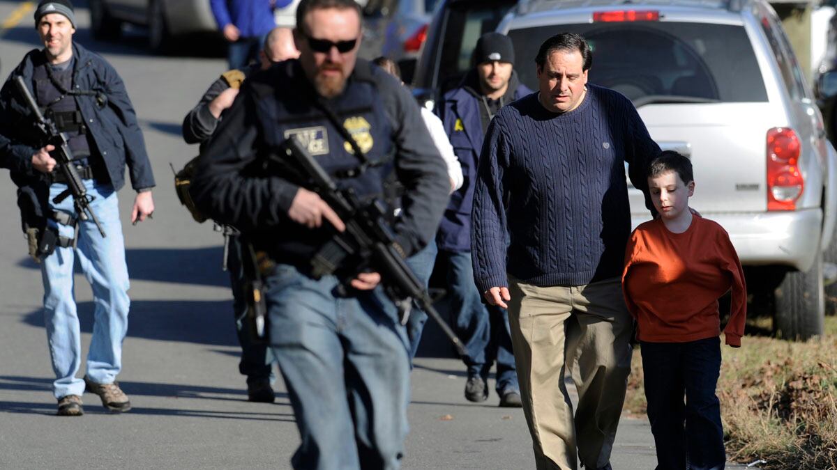 articles/2012/12/14/after-newtown-this-has-to-be-the-time-for-gun-control/school-shooting-reaction-shrum_jpgcup