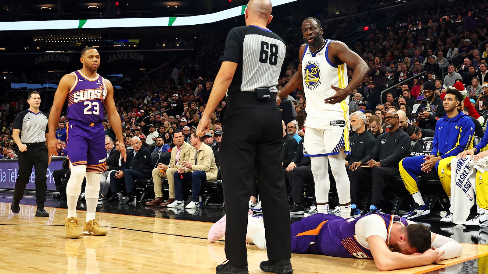 Golden State Warriors forward Draymond Green reacts after being called for a foul on Phoenix Suns center Jusuf Nurkic