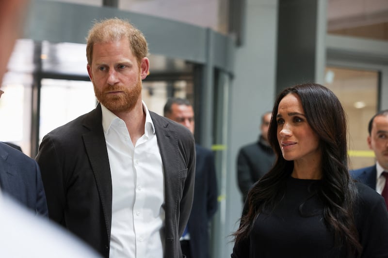 Britain's Prince Harry and Meghan, the Duchess of Sussex, listen as they visit the King Hussein Cancer Center, accompanied by a delegation from the World Health Organization in Amman, Jordan, February 26, 2026.