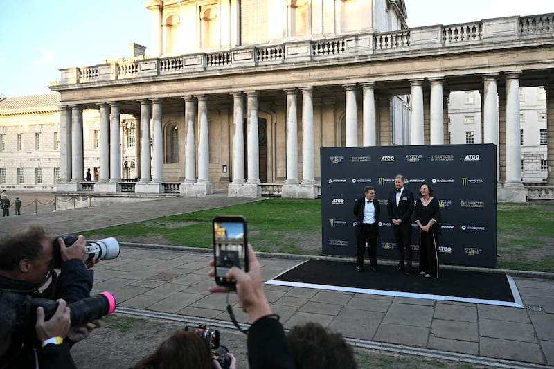 Britain's Prince Harry, Duke of Sussex poses with Invictus CEO Rob Owen (L) and CEO of ATCO Nancy Southern as they arrive to attend the inaugural Invictus Spirit Awards at the Old Royal Naval College in Greenwich, south-east London on September 17, 2026. (Photo by JUSTIN TALLIS / AFP via Getty Images)