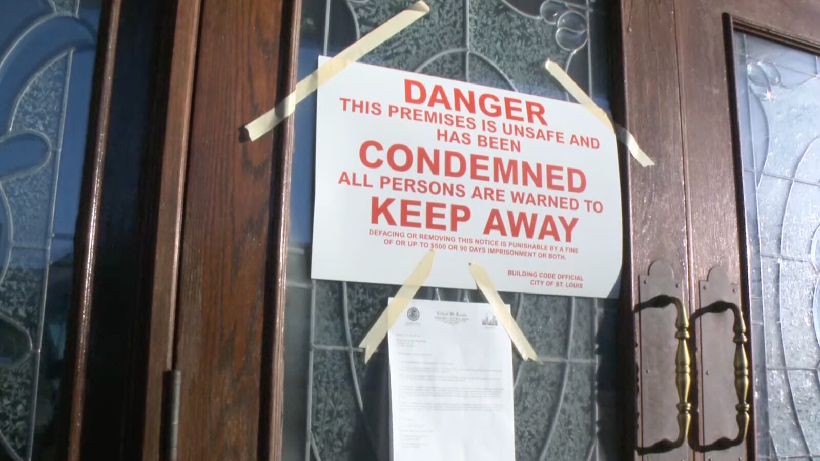 A condemnation notice is displayed at the Mount of Olives Ministry in St. Louis.