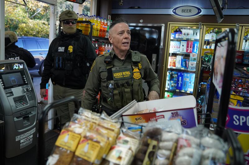 Border Patrol chief Greg Bovino walks through a gas station while searching for undocumented immigrants.
