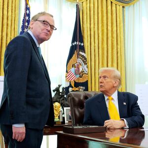 President Donald Trump speaks with Director of the National Economic Council Kevin Hassett in the Oval Office.