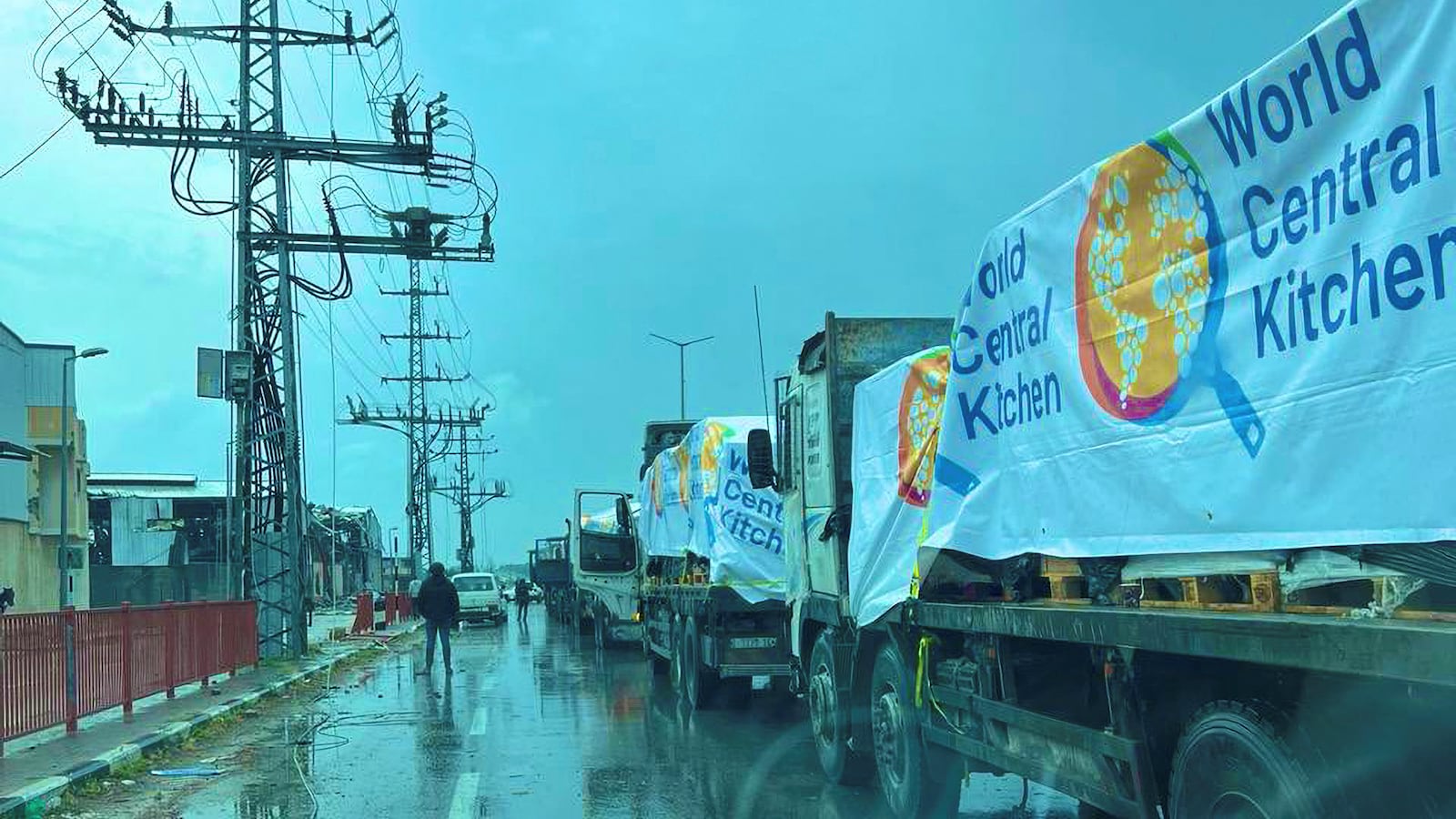 Trucks from World Central Kitchen carrying food aid for Gaza line up at a location given as Gaza City, Gaza, in this picture released on March 19, 2024 and obtained from social media.