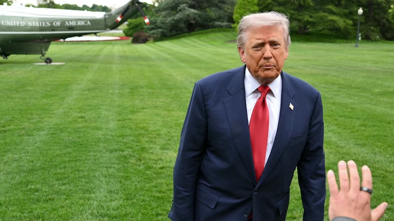 US President Donald Trump speaks to journalists as he makes his way to board Marine One before departing from the South Lawn of the Wxhite House in Washington, DC on May 8, 2026. Trump is traveling to Sterling, Virginia, where he will participate in a LIV Golf dinner. (Photo by Mandel NGAN / AFP via Getty Images)