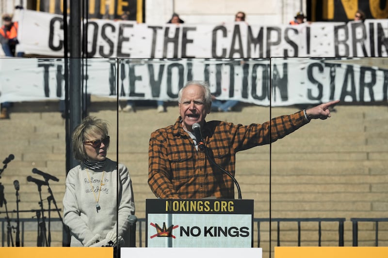 Minnesota Governor Tim Walz speaks behind a glass during a "No Kings" protest against U.S. President Donald Trump's administration policies, in St. Paul, Minnesota, March 28, 2026. REUTERS/Tim Evans