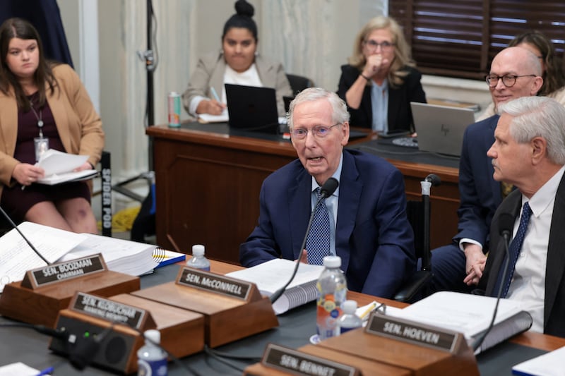Senator Mitch McConnell, sitting with Senator John Hoeven, votes “aye” after being prompted by his team and Republicans while attending a Senate Agriculture Committee meeting on whether to vote the farm bill out of committee on Capitol Hill on September 16, 2026.