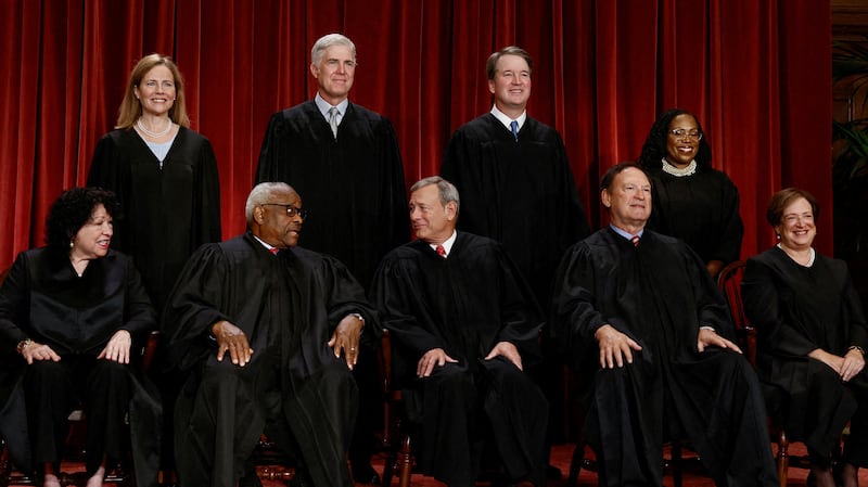 FILE PHOTO: U.S. Supreme Court justices pose for their group portrait at the Supreme Court in Washington, U.S., October 7, 2022. Seated (L-R): Justices Sonia Sotomayor, Clarence Thomas, Chief Justice John G. Roberts, Jr., Samuel A. Alito, Jr. and Elena Kagan. Standing (L-R): Justices Amy Coney Barrett, Neil M. Gorsuch, Brett M. Kavanaugh and Ketanji Brown Jackson. REUTERS/Evelyn Hockstein/File Photo