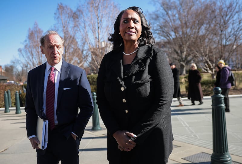 Federal Reserve Governor Lisa Cook and attorney Abbe Lowell outside the Supreme Court on January 21, 2026 where the court heard oral arguments in Trump v. Cook.