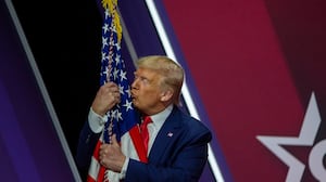 NATIONAL HARBOR, MARYLAND - FEBRUARY 29: President Donald Trump kisses the flag of the United States of America at the annual Conservative Political Action Conference (CPAC) at Gaylord National Resort & Convention Center February 29, 2020 in National Harbor, Maryland. Conservatives gather at the annual event to discuss their agenda. (Photo by Tasos Katopodis/Getty Images)