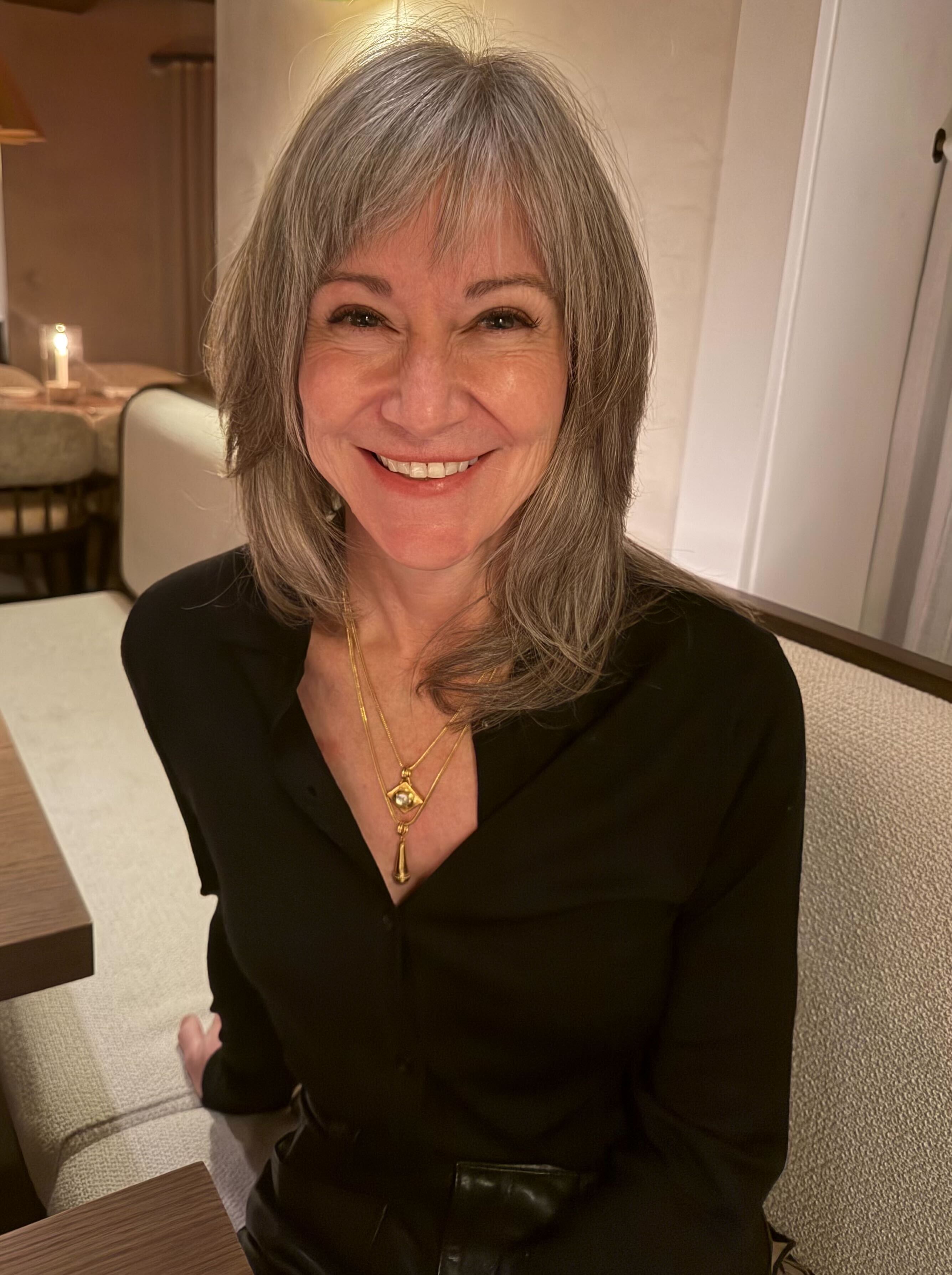 Colleen, 60, looking thrilled and fabulous with her newly aligned smile.