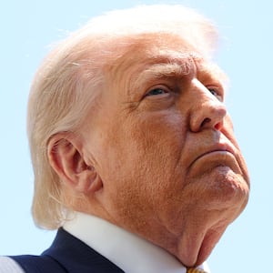 WASHINGTON, DC - MAY 12: U.S. President Donald Trump speaks in front of the American flag to the press as he departs the White House on May 12, 2026 in Washington, DC. Trump is traveling to China, where he is scheduled to meet with Chinese President Xi Jinping for expected talks on the Iran conflict, trade imbalances, regional security, and economic cooperation between the two countries. (Photo by Kevin Dietsch/Getty Images)