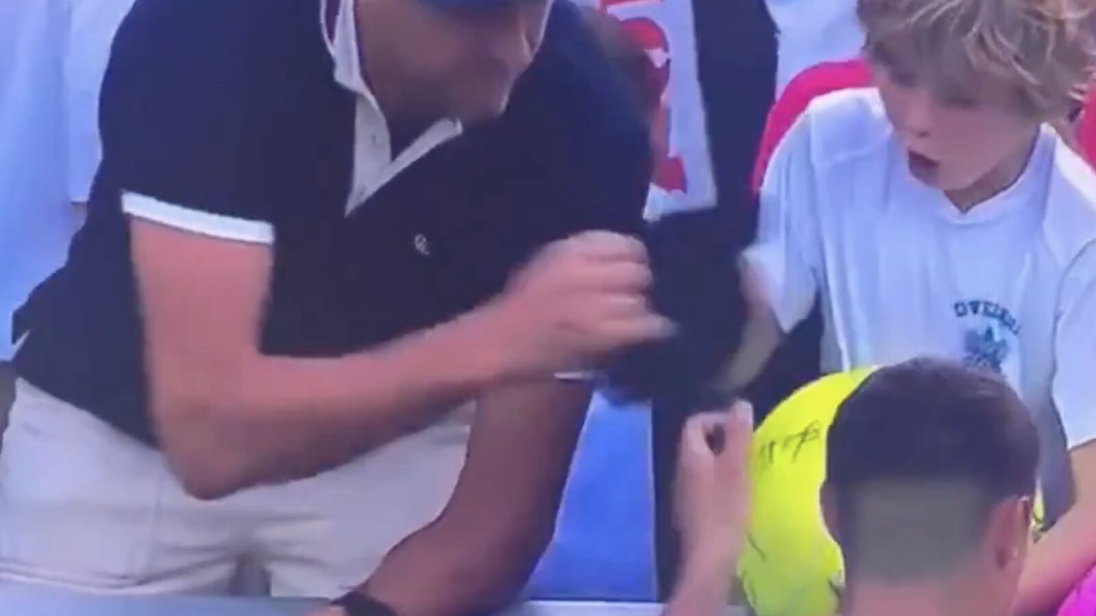 CEO snatches cap from child's hand