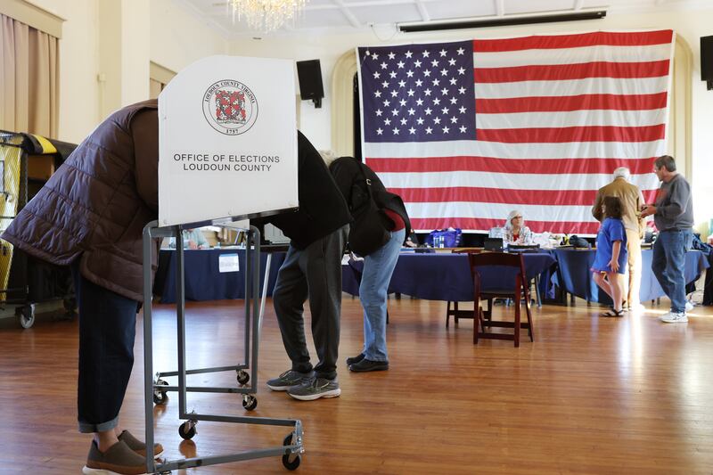 Voters fill out their ballots at a polling station in the Hillsboro Old Stone School on November 04, 2025 in Hillsboro, Virginia. Virginians are voting in a series of state contests including for governor and attorney general.