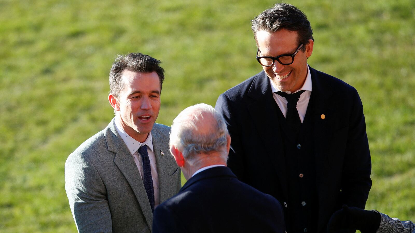 Wrexham Football Club co-owners Ryan Reynolds and Rob McElhenney welcome Britain’s King Charles, in Wrexham, Britain, Dec. 9, 2022.