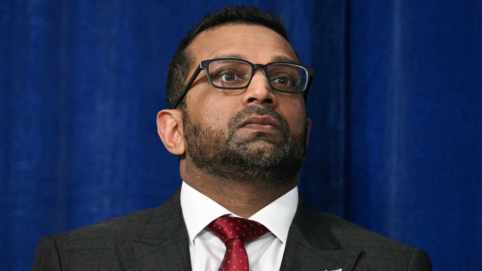 FBI Director Kash Patel looks on as President Donald Trump speaks to the press following U.S. military actions in Venezuela, at his Mar-a-Lago residence in Palm Beach, Florida, on January 3, 2026.