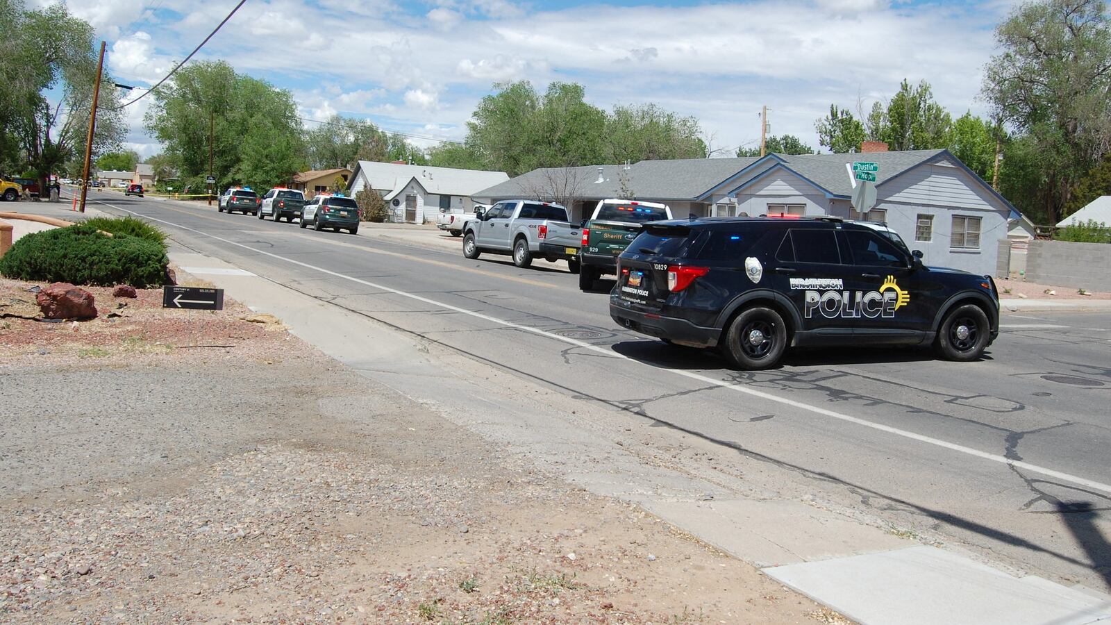 Law enforcement officers deploy at the scene of a fatal shooting in Farmington,