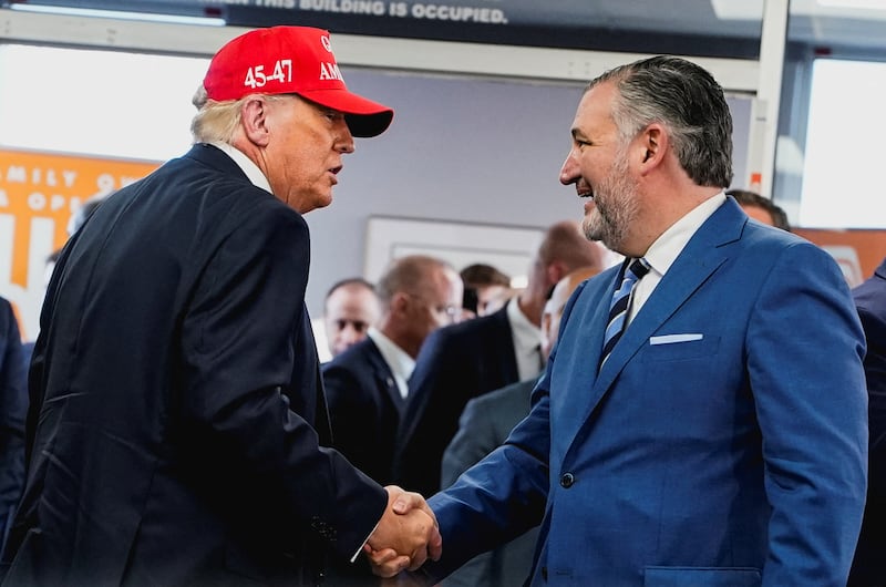 U.S. President Donald Trump shakes hands with U.S. Senator Ted Cruz (R-TX) during a visit to a Whataburger in Corpus Christi, Texas, U.S., February 27, 2026.